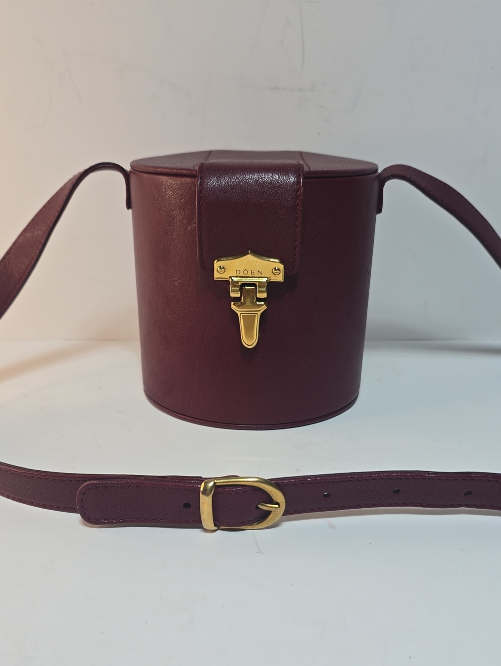 Doen Burgundy Leather Crossbody Cylinder Bag with Gold Hardware